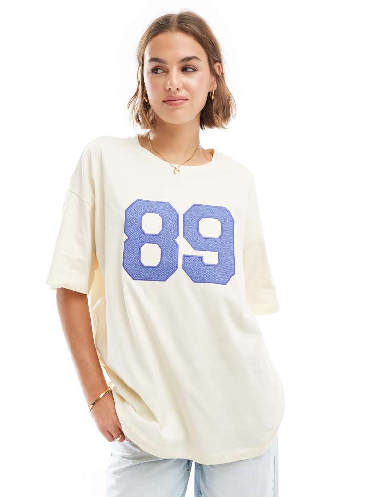 ASOS DESIGN oversized sporty t-shirt with denim applique in white ASOS DESIGN