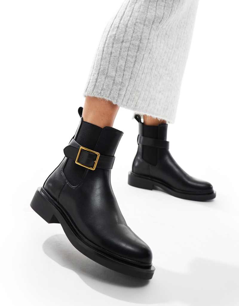 ASOS DESIGN Aurora flat boots with buckle strap in black ASOS DESIGN