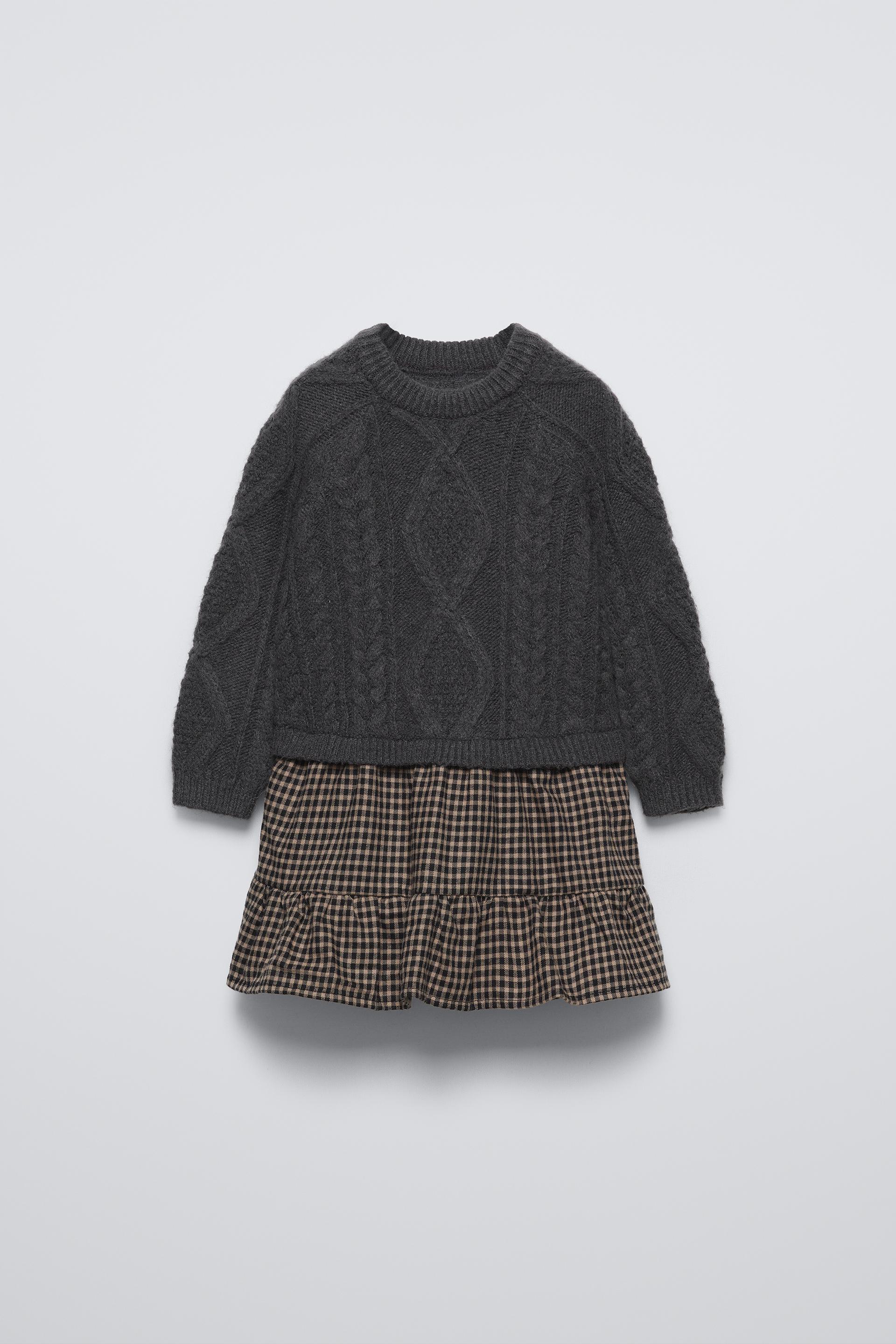 Knit dress with round neck and long sleeves. Checkered print hem. Contrasting color lined interior. ZARA