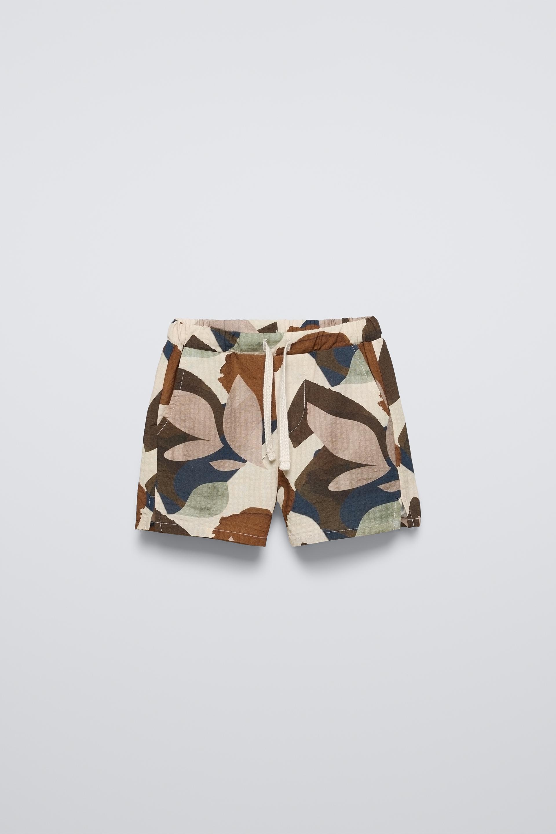 Shorts with elastic waistband and adjustable front drawstring. Front pockets and back patch pockets. ZARA