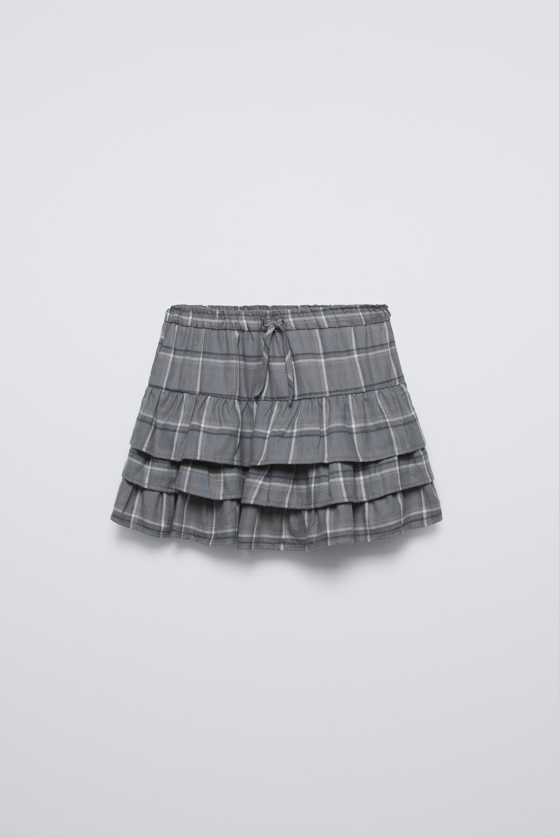 Skirt with elastic waistband and front drawstring appliqués. Ruffle detail and plaid print. ZARA