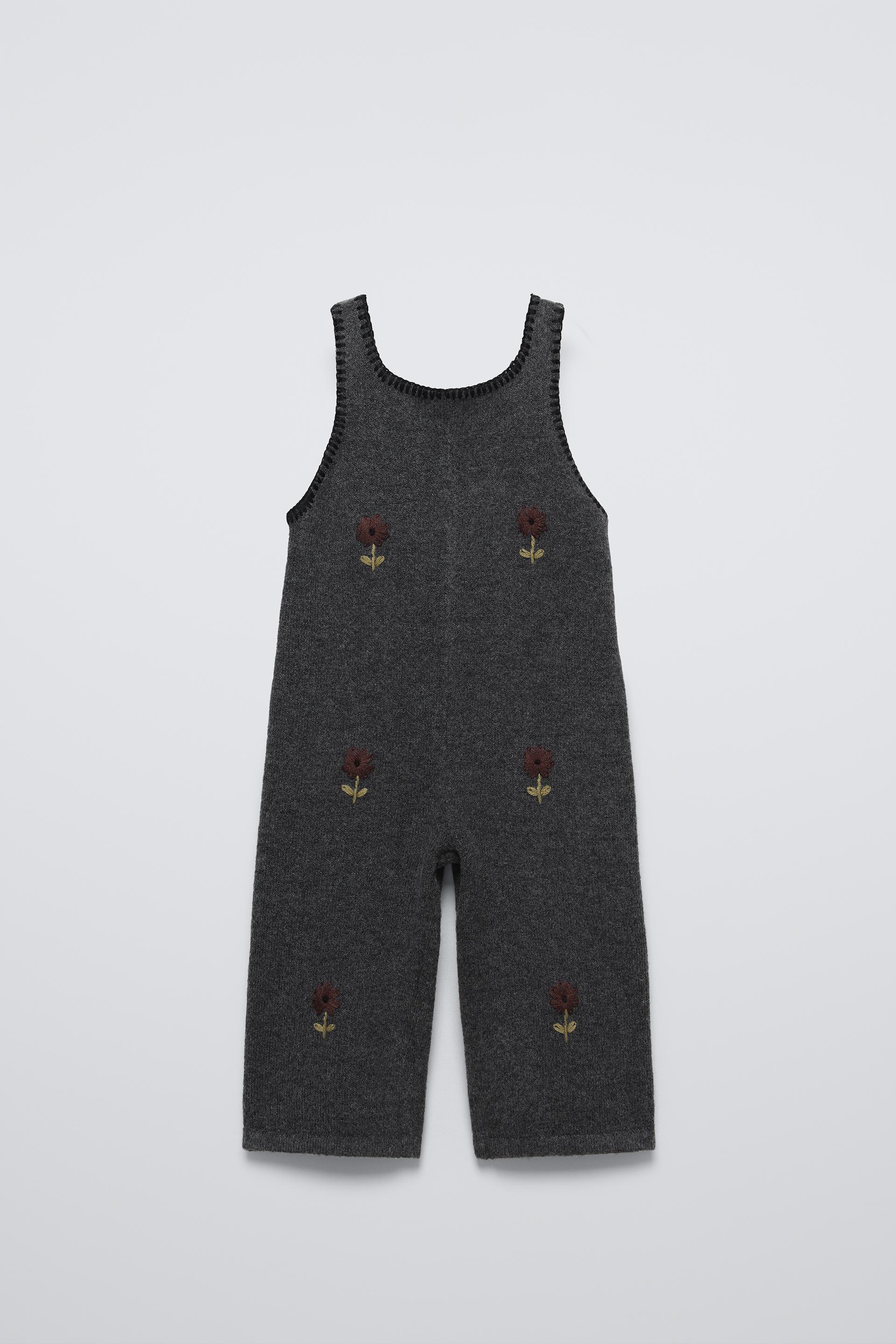 Sleeveless knit overalls with round neckline. Front floral embroidered detail. ZARA