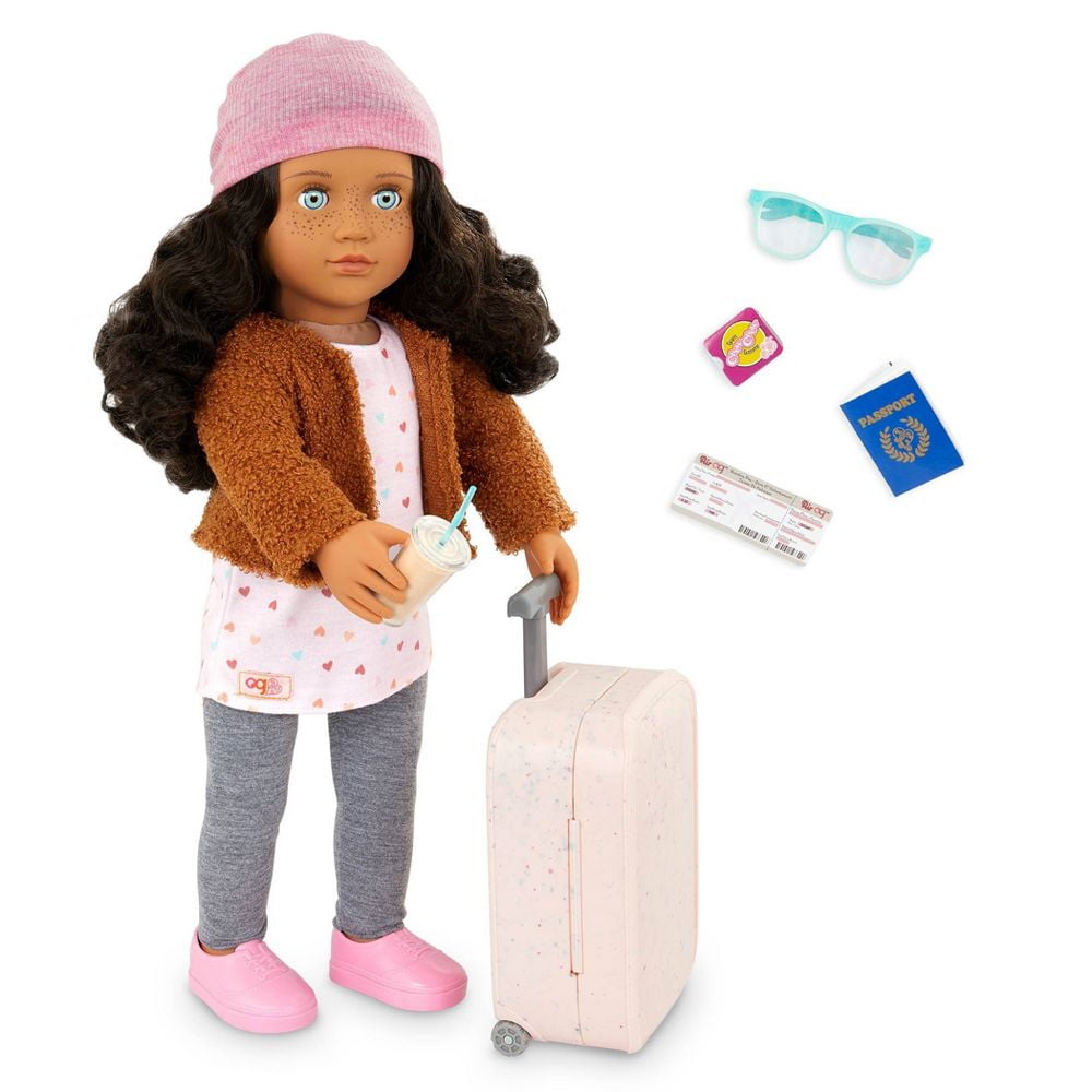 Lisandra & Rolling Luggage 18" Travel Doll, Blue Eyes, Brown Hair Huggable (doll, polka heart tunic, jacket, leggings, a pair of undies, shoes, beanie hat, luggage, sunglasses, iced latte, passport) Our Generation