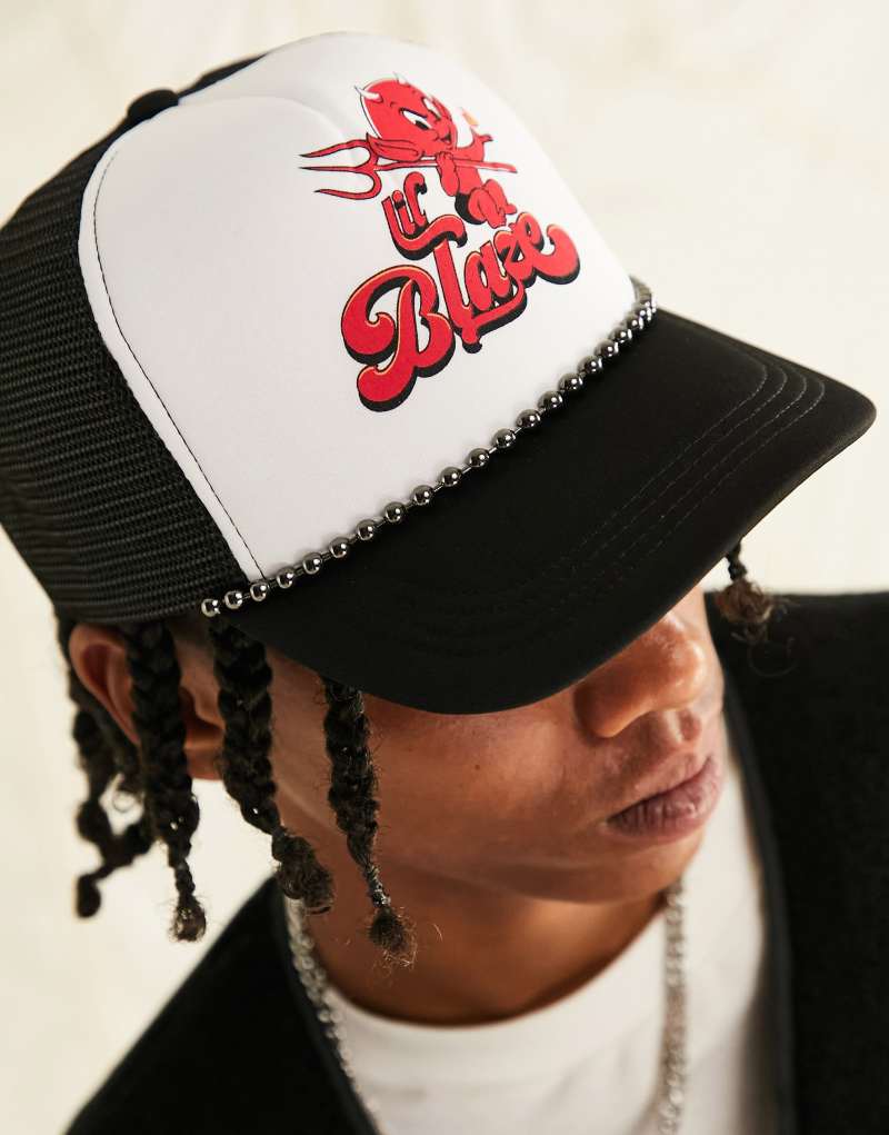 ASOS DESIGN trucker cap with red flame graphic in black and white ASOS DESIGN