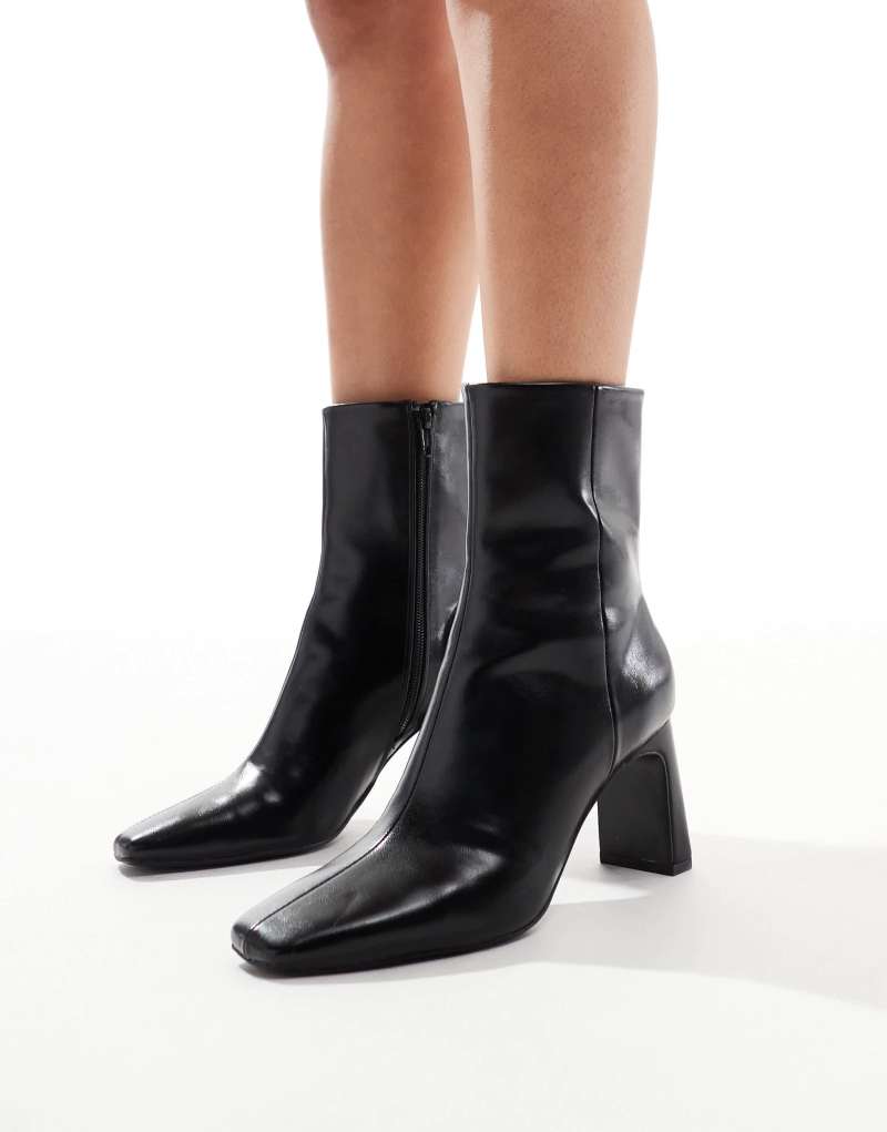 ASOS DESIGN Reach set back mid heel boots in black ASOS DESIGN