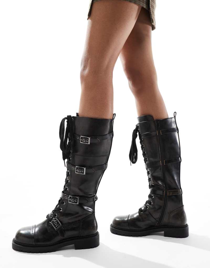 ASOS DESIGN Canada flat chunky buckle knee boots in black ASOS DESIGN