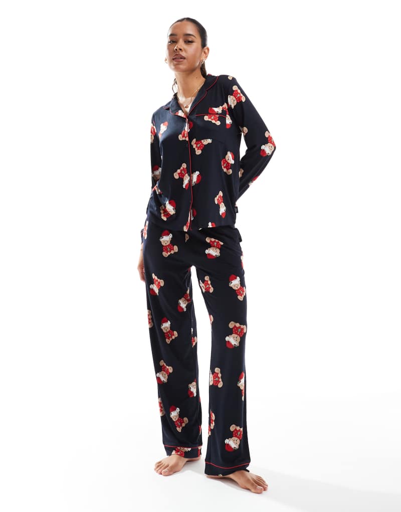 Chelsea Peers Exclusive His & Hers Christmas teddy print long sleeve revere top and pajama pants set in navy Chelsea Peers