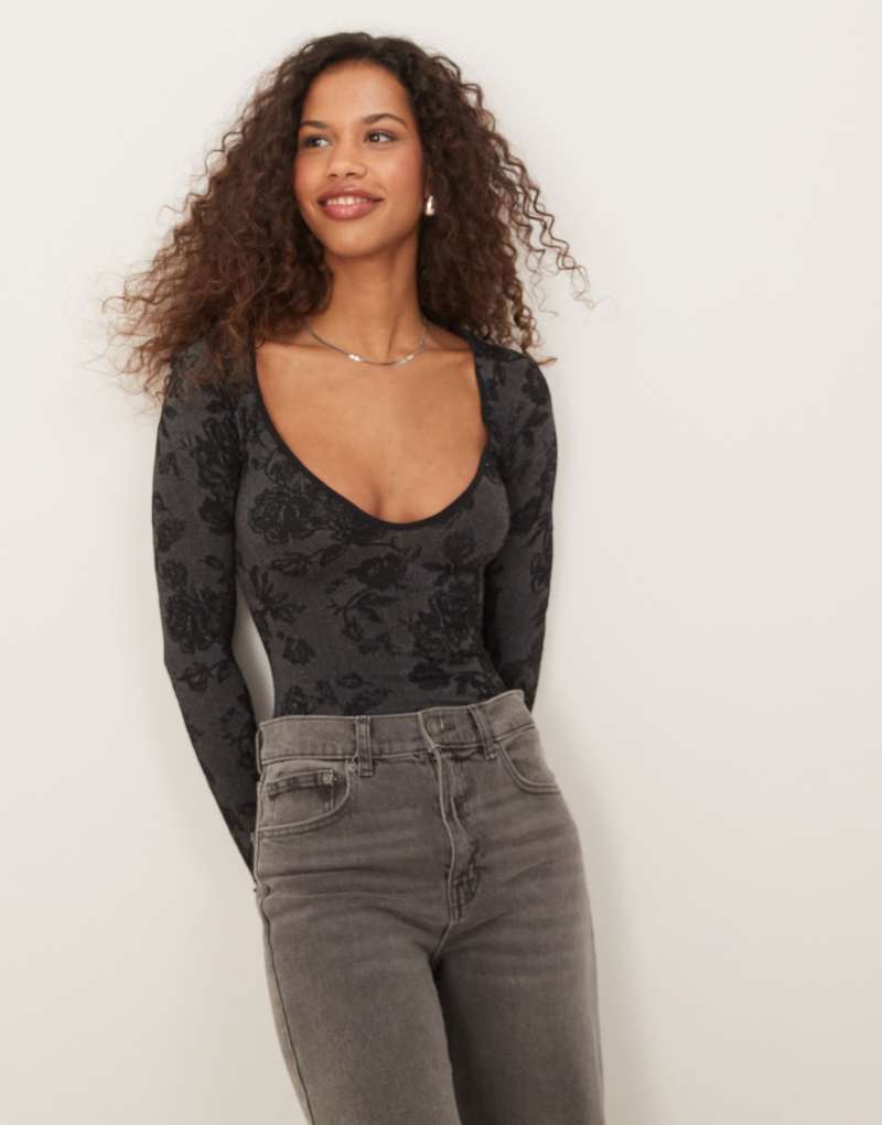 Free People textured long sleeve bodysuit in black Free People