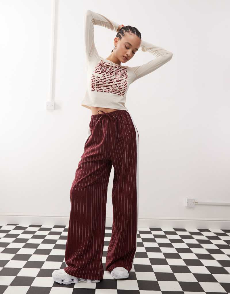 Reclaimed Vintage pinstripe pants with side panel in burgundy Reclaimed Vintage