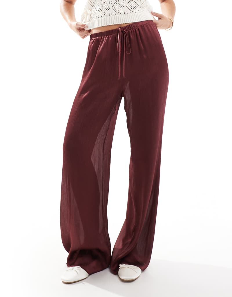 ASOS DESIGN wide leg semi sheer plisse pants in burgundy ASOS DESIGN