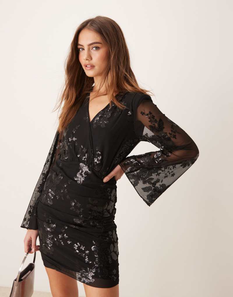 Gina Tricot mini dress with wrap front in black with textured shimmer jacquard floral pattern GINA TRICOT