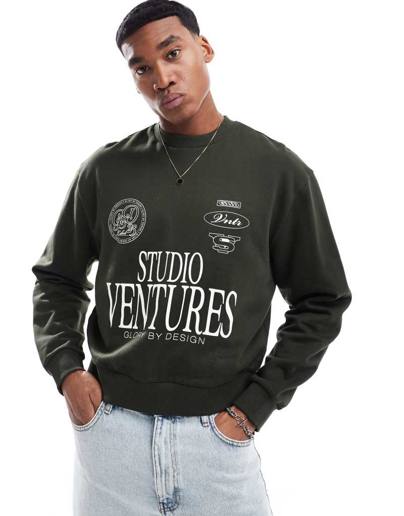 ASOS DESIGN oversized drop shoulder sweatshirt with studio ventures print in green ASOS DESIGN