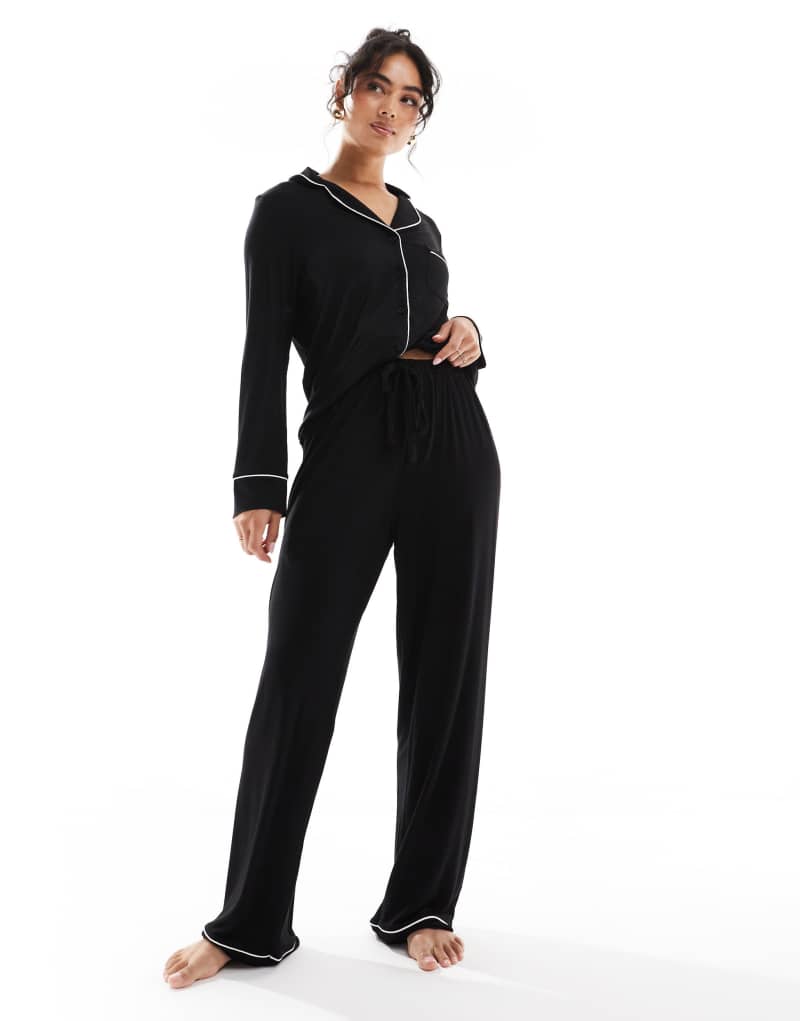 ASOS DESIGN super soft long sleeve shirt & pants pajama set with contrast piping in black ASOS DESIGN