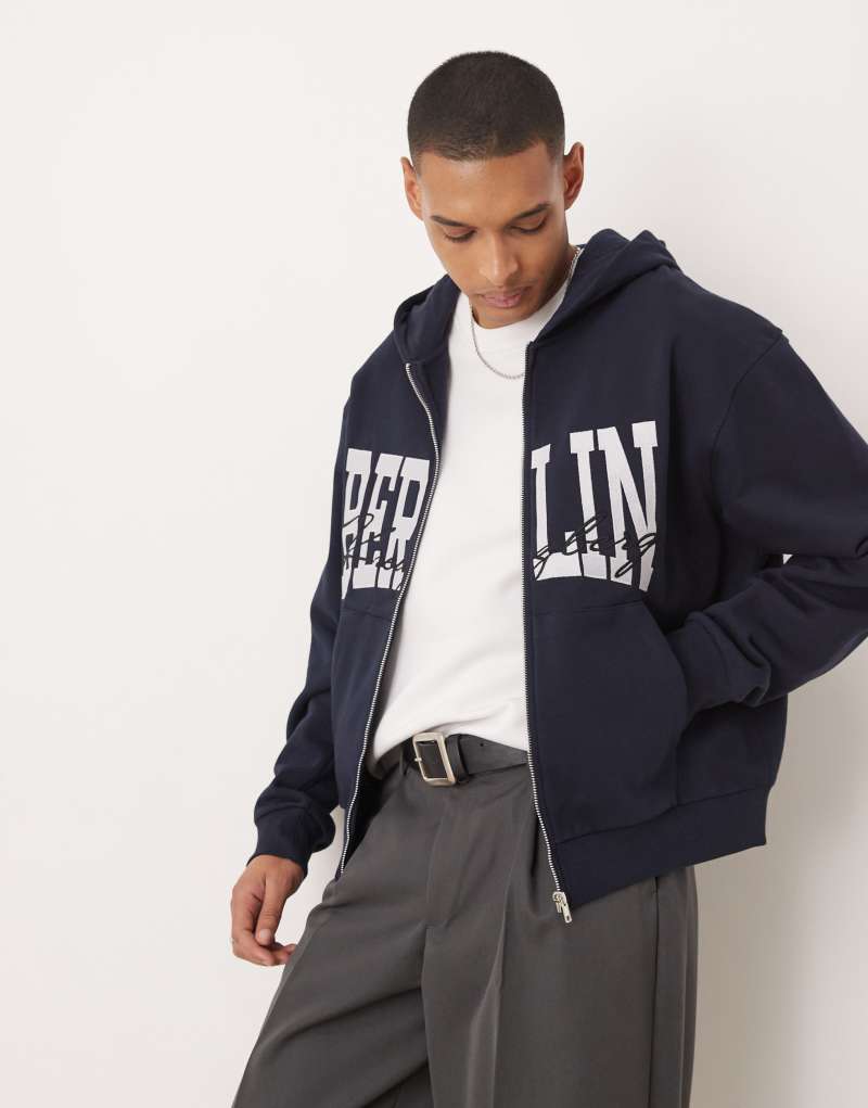 ASOS DESIGN oversized boxy zip through hoodie with berlin print in navy ASOS DESIGN