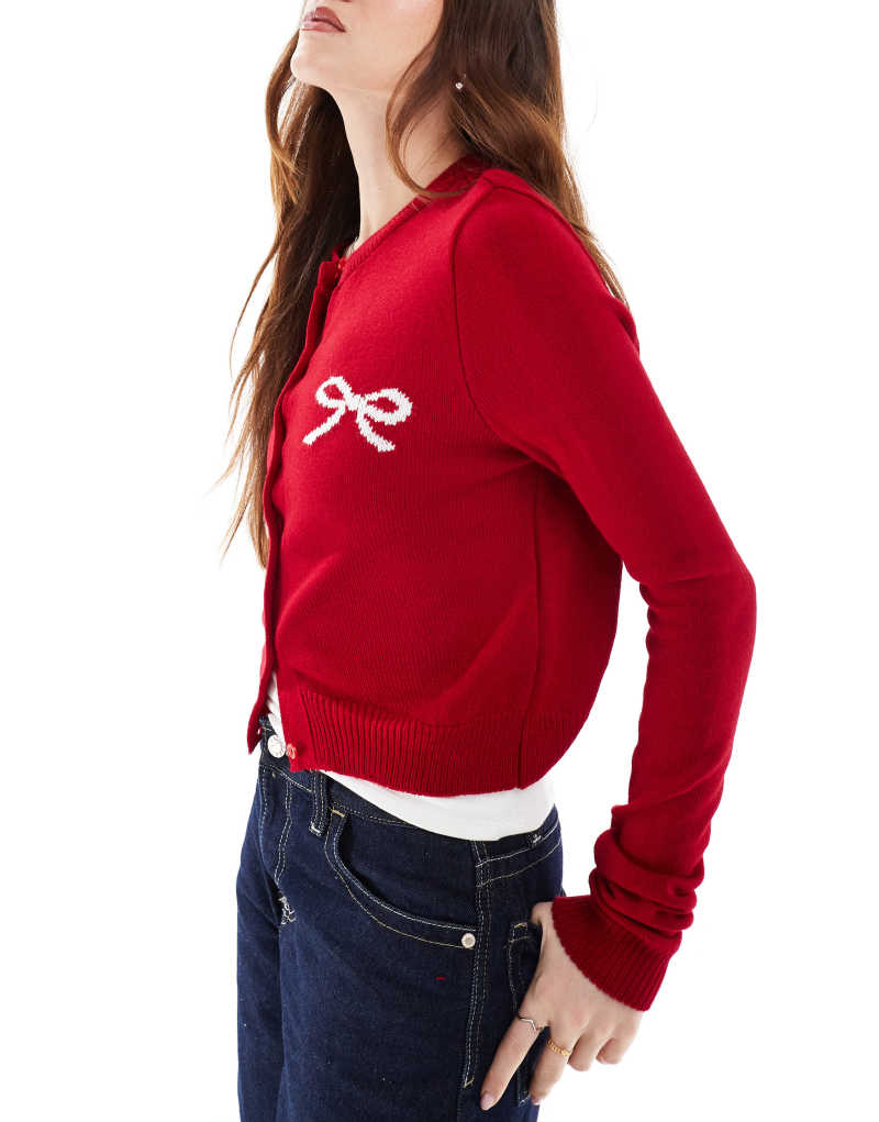 ASOS DESIGN knit crew neck cardigan with bow logo detail in red ASOS DESIGN