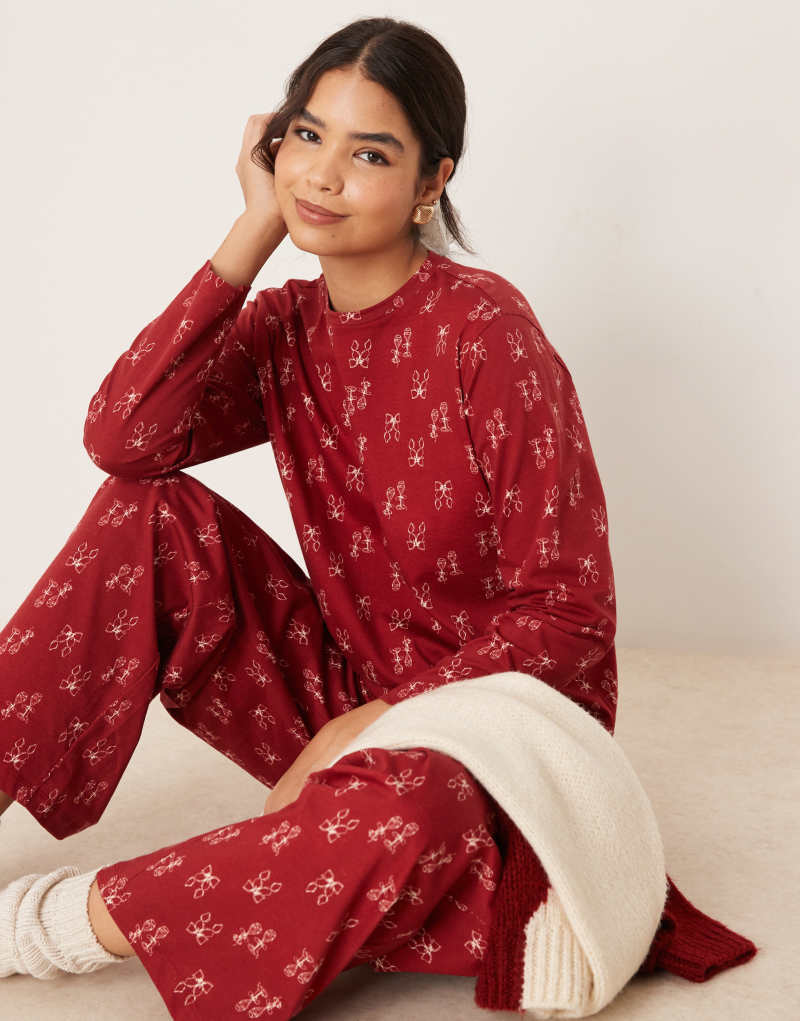 ASOS DESIGN top and pants pajama set in red bow print Asos Design