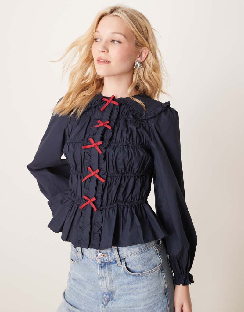 Glamorous crinkle long sleeve top with red tie front bows in navy Glamorous