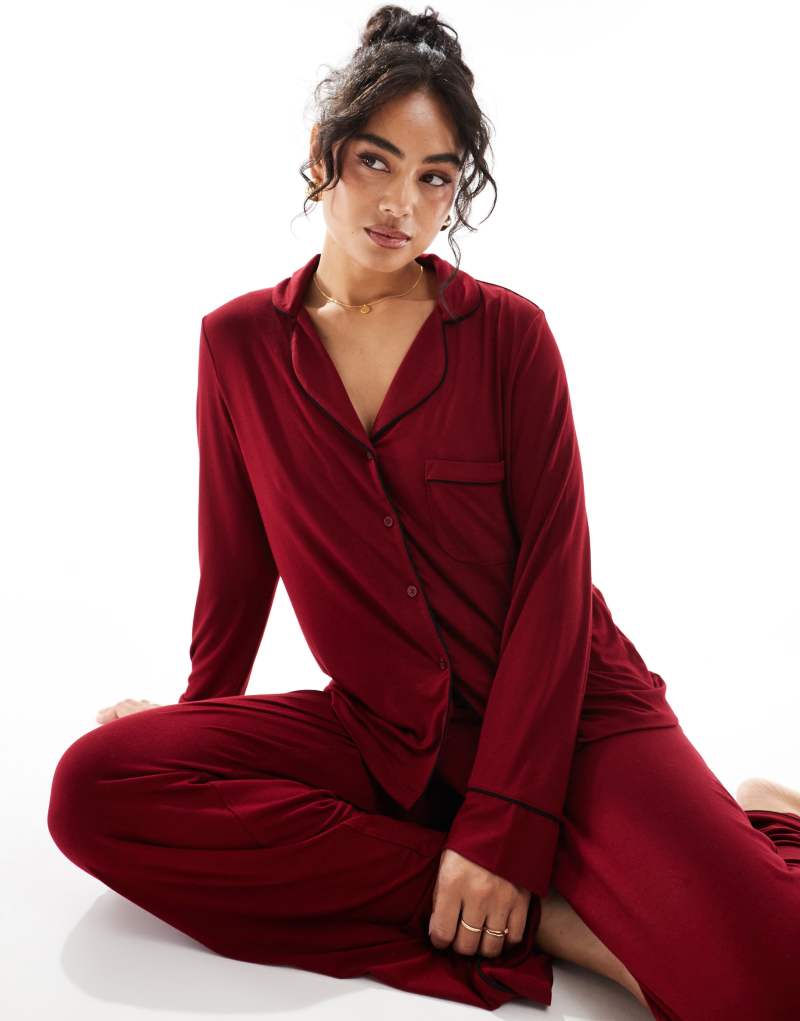 ASOS DESIGN super soft long sleeve shirt & pants pajama set with contrast piping in burugundy Asos Design