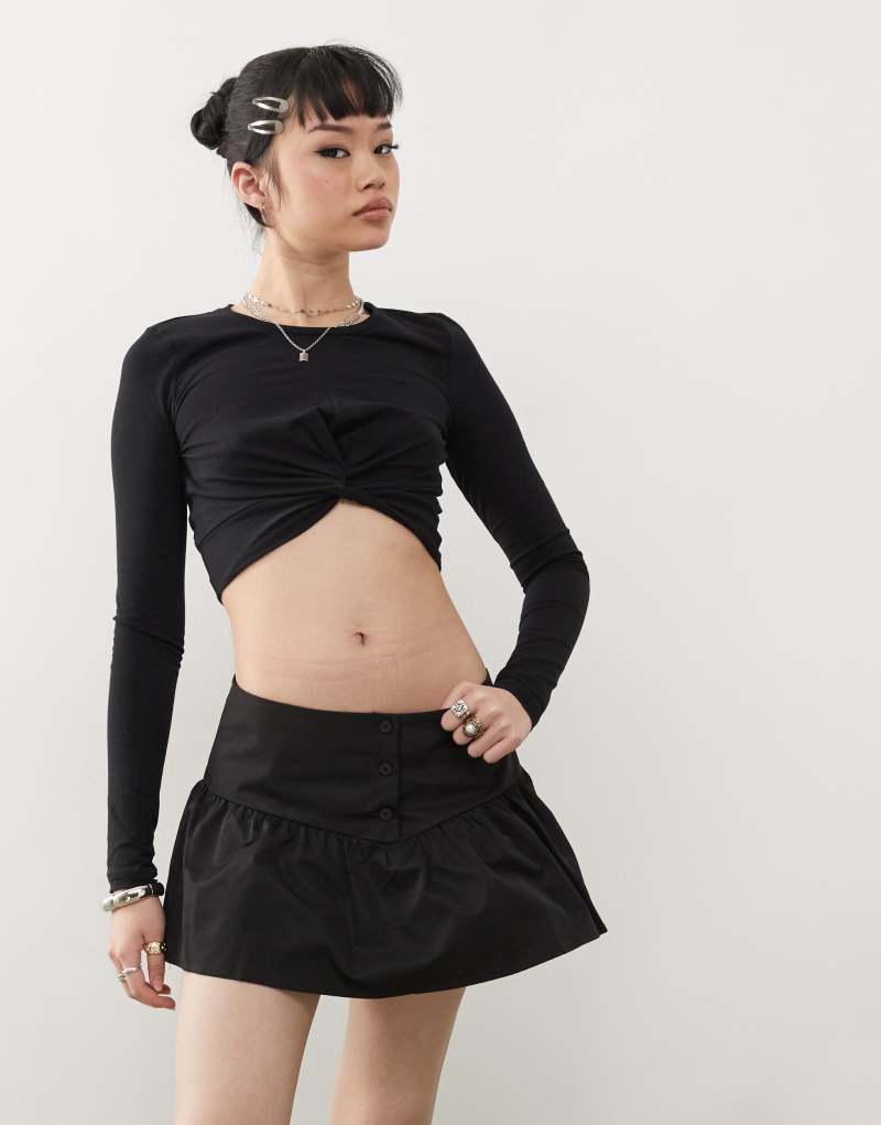 Noisy May long sleeve twist front crop top in black Noisy May