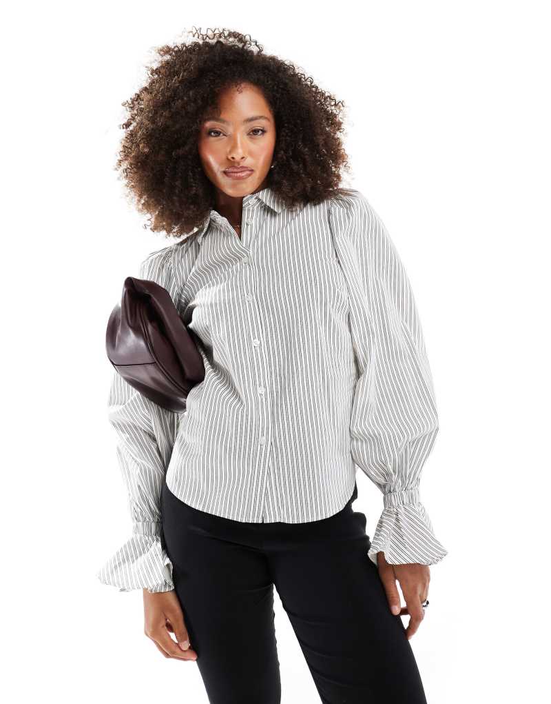 ASOS DESIGN cotton volume sleeve ruffle cuff shirt in black and white stripe Asos Design