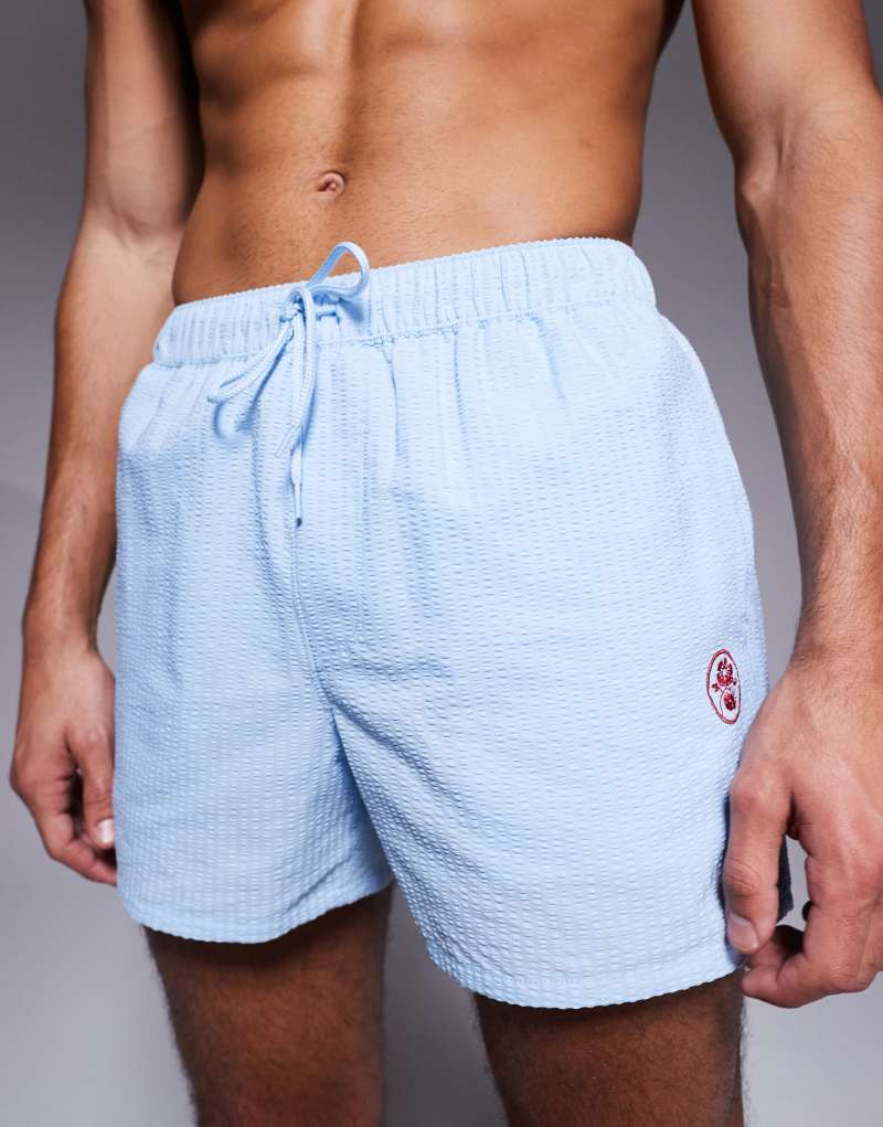 ASOS DESIGN seersucker swim shorts in short length with embroidery   Asos Design