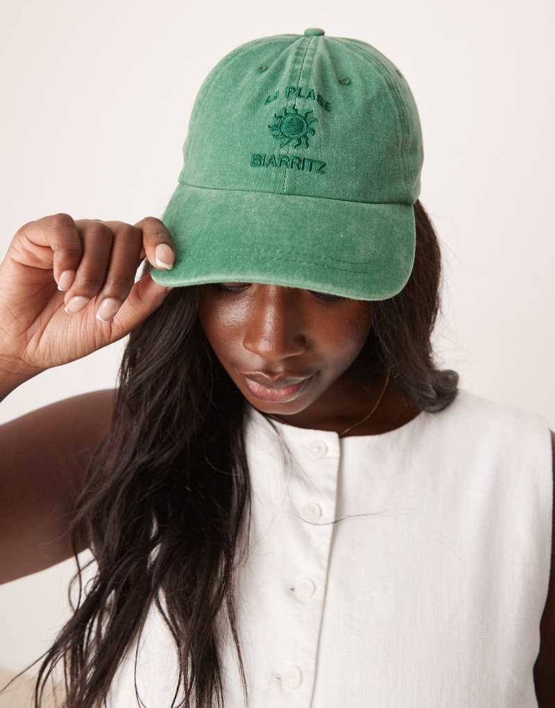 ASOS DESIGN washed cap in green with slogan Asos Design