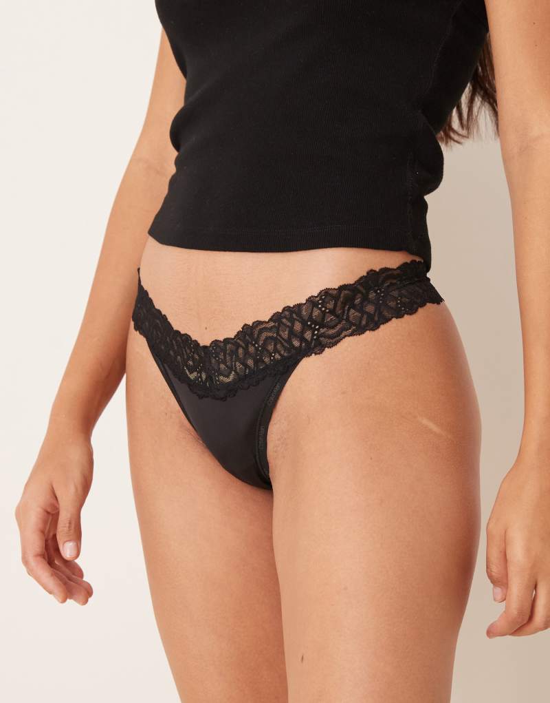 Calvin Klein Attraction lace detail thong in black Calvin Klein