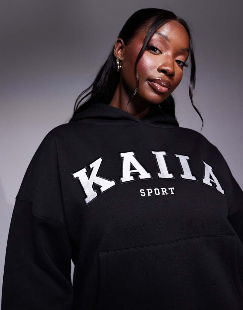 Kaiia Plus logo oversized hoodie in black Kaiia