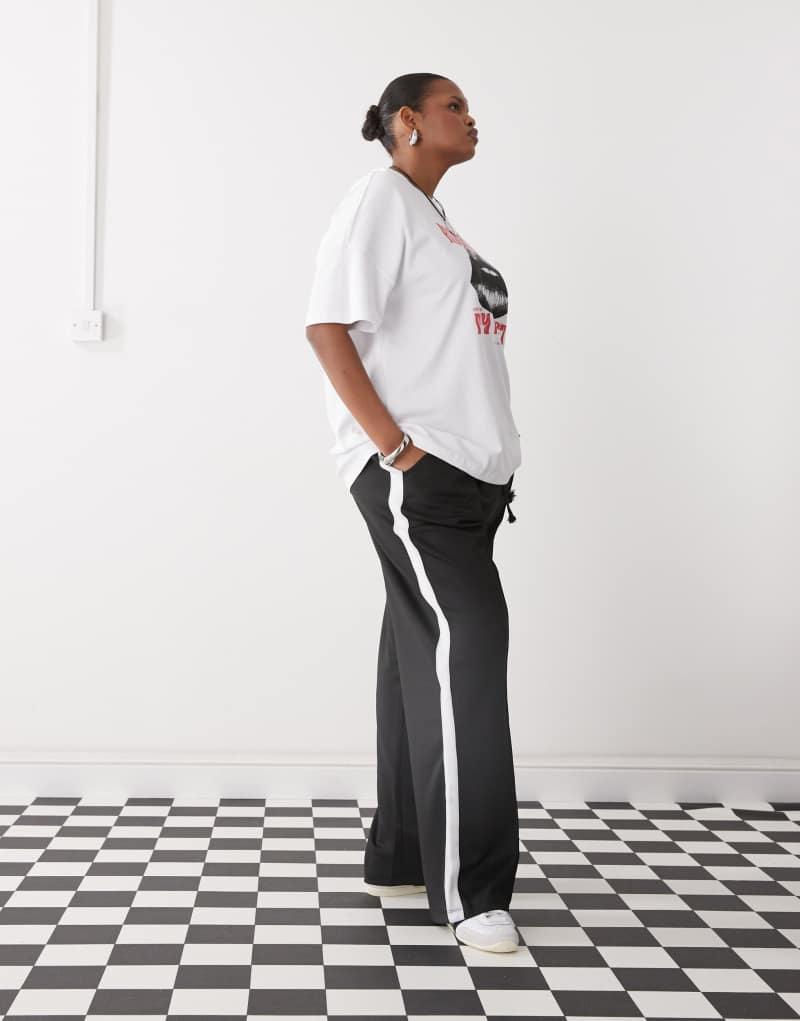 Noisy May Curve wide leg sweatpants with side stripe in black Noisy May