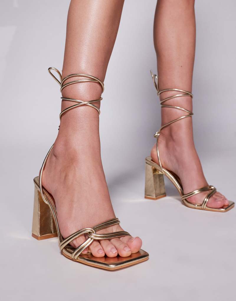 Public Desire Wide Fit Schiffer block heeled sandals with tie leg in gold Public Desire