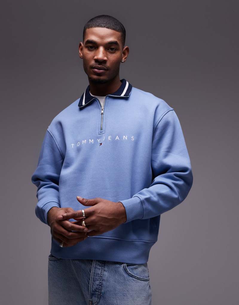 Tommy Jeans linear logo half zip sweatshirt in washed blue Tommy Jeans